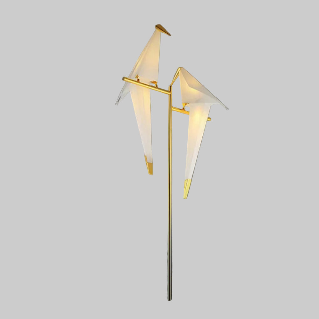 "Elegant wireless origami bird lamp with magnetic attachment emitting warm light; enhances home decor with artistic design."