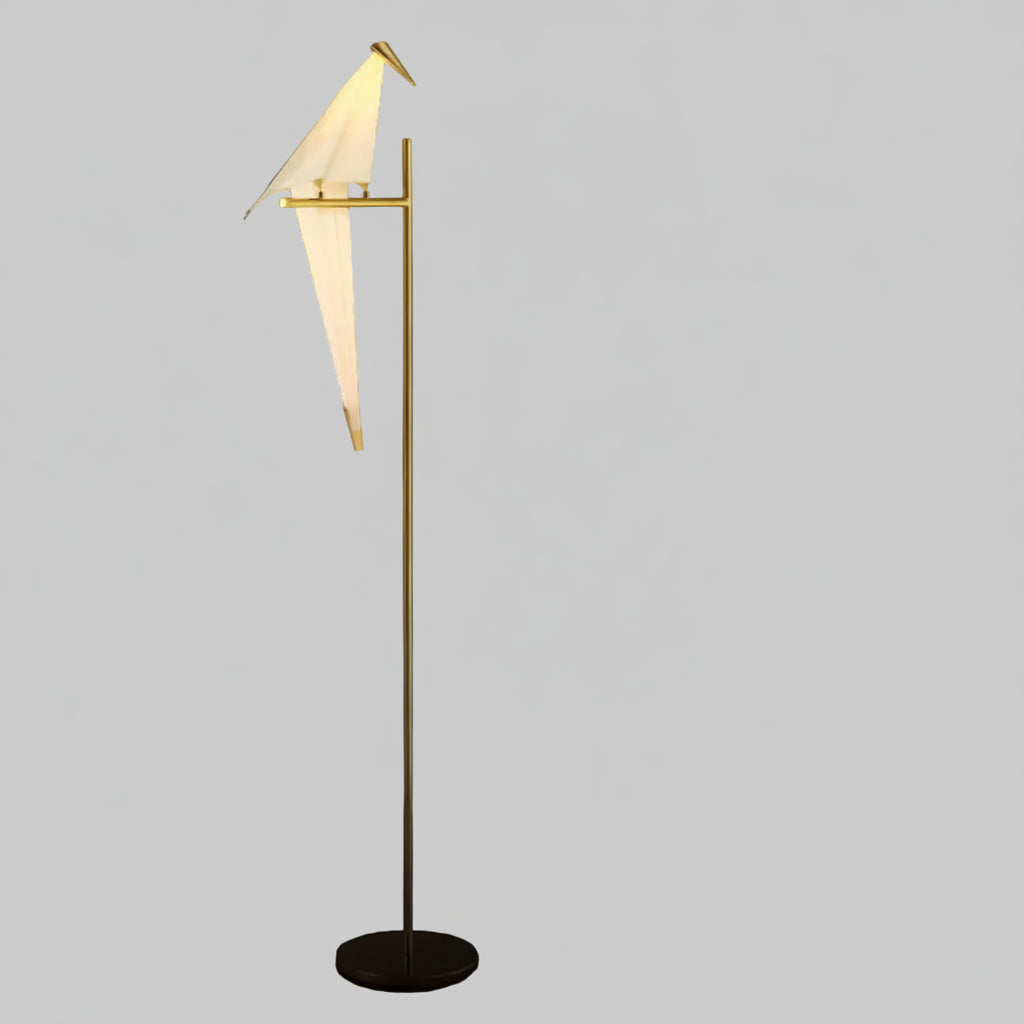 "Elegant wireless origami bird lamp with magnetic attachment emitting warm light; enhances home decor with artistic design."